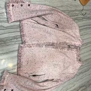 Fringe Pink with dark grey flecks. Snap detail on sleeve. Zipper pocket